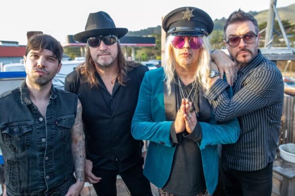 Enuff Z' Nuff band at Winters Tavern is California standing outside together pre-performance